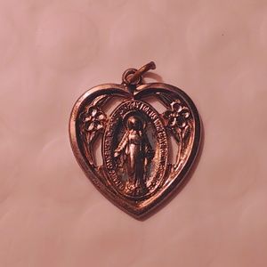 Mother Mary Miraculous Medal in a Sacred Heart